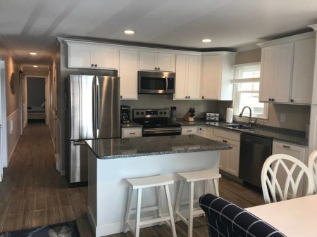 stainless steel appliances and well stocked kitchen